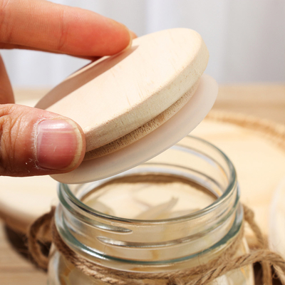 I coperchi di legno dei coperchi del barattolo di stoccaggio di vetro della cucina dell'alimento con il cerchio del silicio hanno sigillato bene